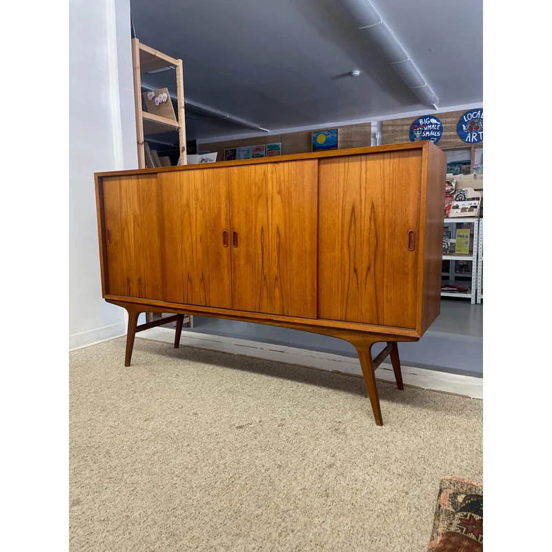 Mid-Century Danish Modern Likely Teak Credenza with Sculpted Base Likely Rosewood Drawer Fronts with Brass toned Pulls (Available by Online Purchase Only)